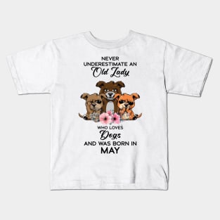 Never Underestimate An Old Woman Who Loves Dogs And Was Born In May Kids T-Shirt